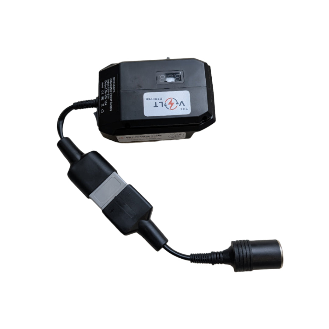 Black electronic device with a cable on a beige surface